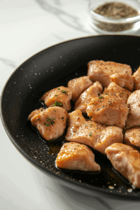 This image shows chicken cooking in the skillet, stirred occasionally
