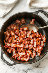 cooking-the-diced-bacon-in-a-dutch-oven over medium heat