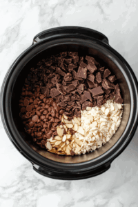 chopped-almond-bark-chocolate-chips-and-german-chocolate-to be melted in-a-crockpot