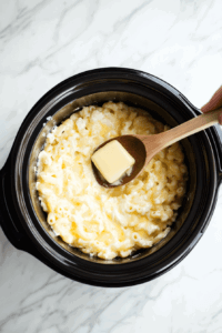 mixing-butter-in-the-warm-macaroni to mix the buttery flavour easily in the warm macaroni
