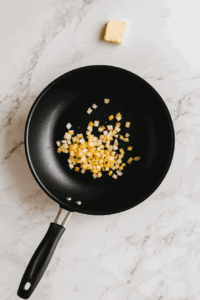 This image shows onions sautéing until golden