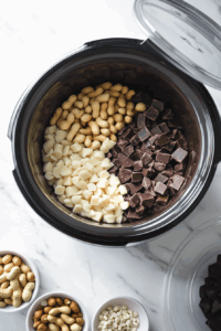 white-chocolate-peanuts-chocolate-chips-and-german-chocolate chopped in a bowl