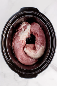 Add a pork tenderloin to a 6-quart slow cooker