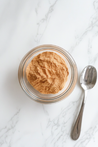 this image shows bowl filled with various spices and seasonings being mixed together, ready to coat the crockpot whole chicken for a flavorful dish.