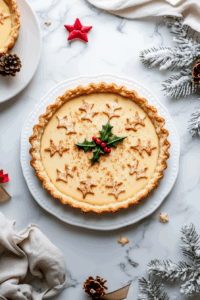 This image shows the freshly baked tart resting to cool, with a golden crust and set custard filling.