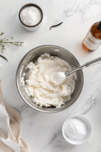 This image shows the cooked pudding mixture being transferred to a bowl and left to cool completely before assembling the pie.