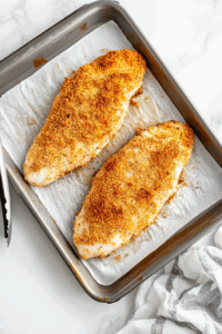 crispy-baked-fish-fillets-on-a-parchment-lined-baking-tray
