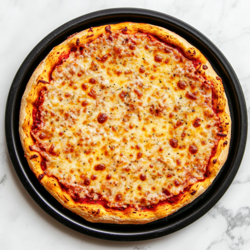 This image shows a delicious low-carb fathead pizza with gooey, melted cheese, served hot on a sleek black round plate, perfect for a keto-friendly meal.