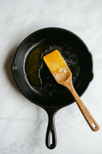 This image shows a pan on medium heat with butter and olive oil melting together, forming the rich base for the Garlic Honey Lime Shrimp recipe.