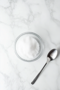 This image shows the cinnamon-sugar mixture being prepared to top the Vegan Sugar Cream Pie, adding a sweet and aromatic finish to the dessert.