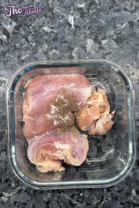 Season chicken breasts on both sides