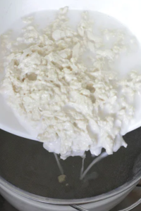 Squeeze and rinse the dough underwater