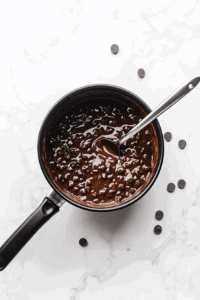 this image shows Chocolate chips are mixed into the filling base, creating a rich and decadent chocolate layer for the pie.