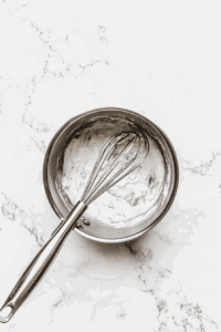This image shows the pie filling being thickened on the stovetop, forming the smooth and creamy texture for the Vegan Sugar Cream Pie.
