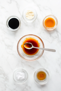This image shows spicy mayo being whisked together, creating a smooth and flavorful topping for the chicken katsu rice bowl.