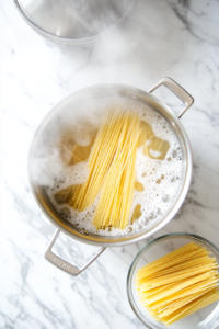 boiling-fettuccine-pasta-until-perfectly-tender-for-chicken-tikka-alfredo