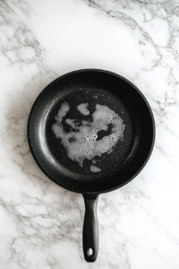 This image shows butter melting in a pan, creating the foundation for a luscious homemade ranch-infused sauce.