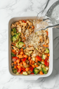 This image shows all the prepared ingredients being mixed in a baking dish, ready for baking.