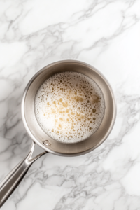 This image shows candy mixture reached a desired temperature for a coating that is crisp, crackly candy apple shell.