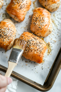coating-pigs-in-a-blanket-before-baking