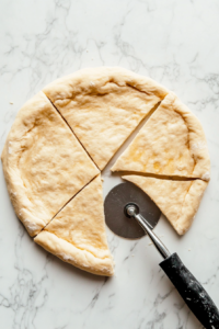 cutting-crescent-dough-for-pigs-in-a-blanket