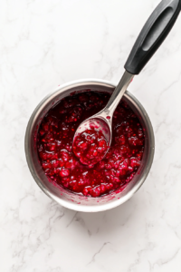 dissolved-gelatin-being-poured-back-into-a-measuring-cup-after-heating-in-a-saucepan
