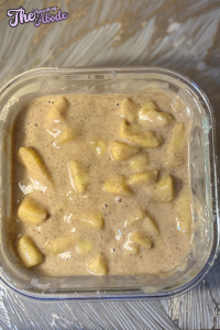 Fold the warm apples into the batter