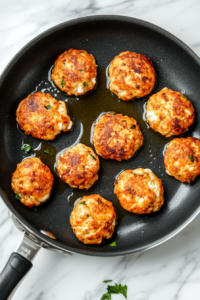 this image shows forming on one side of the fritters turning golden and crispy