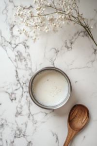 This image shows milk being heated in a small saucepan, a crucial step in preparing the soft and fluffy dough for Strawberry Cinnamon Rolls.
