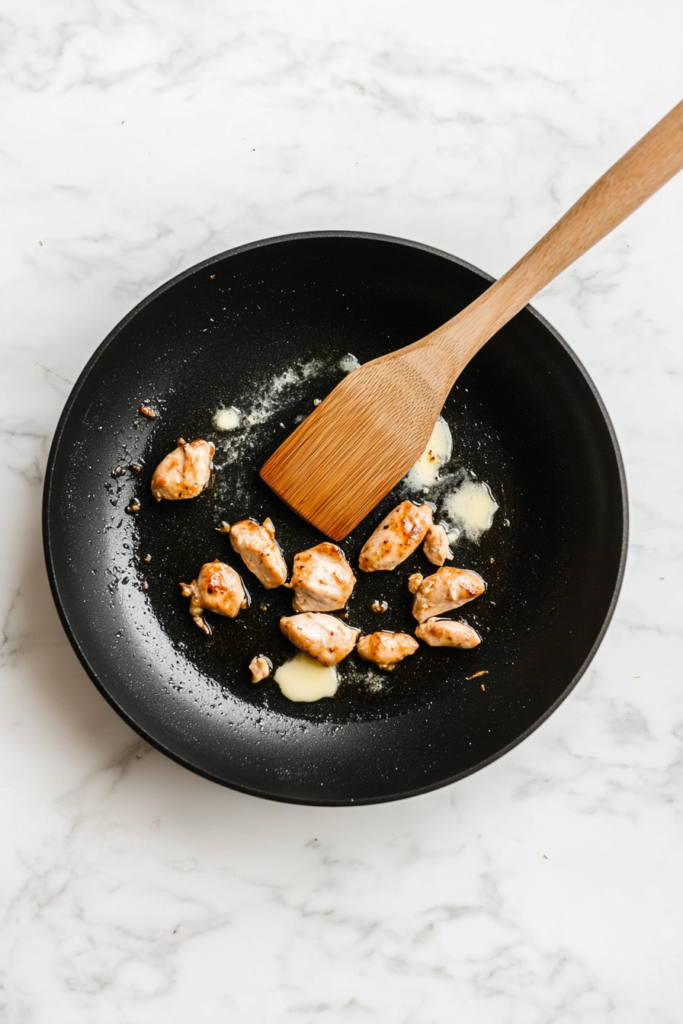 heating-oil-and-butter-in-a-skillet-for-cooking-chicken-6280994-683x1024