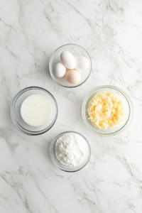 This image shows battered shrimp sizzling in hot oil, turning golden brown for a perfectly crispy texture.
