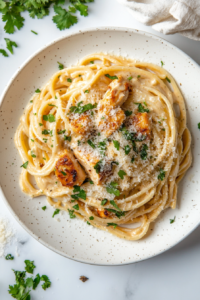 plating-chicken-tikka-alfredo-with-fresh-cilantro-for-the-perfect-finish-2