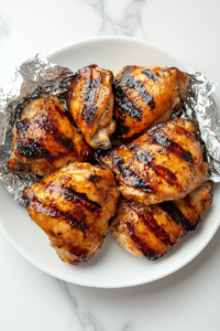 This image shows a top-down view of freshly cooked chicken resting, allowing the juices to redistribute for maximum tenderness.