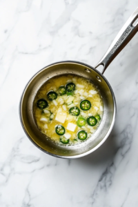 sauteing-garlic-and-jalapeno-in-a-pan-for-chicken-tequila-fettuccine