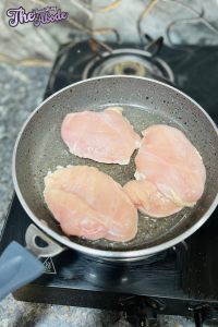 Season chicken with salt and pepper