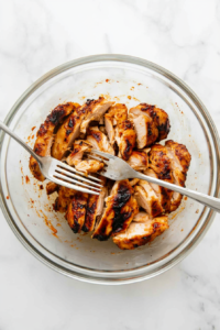 shredding-cooked-chicken-for-tostadas