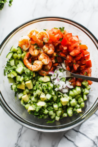 tossing-the-shrimp-and-vegetables-together-for-a-vibrant-salsa