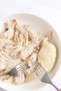 Using tongs, transfer the chicken