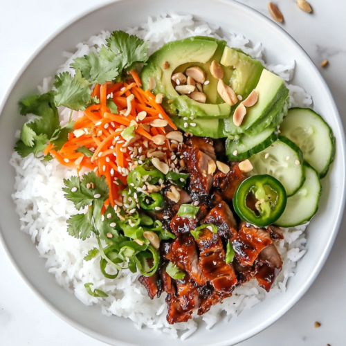 vietnamese-rice-bowls-with-avocado-sesame-topping-and-shredded-carrots
