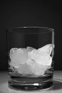 Fill a highball glass with ice