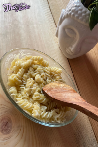 Add the cooked pasta to the cheese sauce