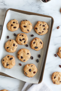 This image shows soul cake dough pieces being neatly arranged on a baking tray, ready to go into the oven.