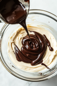 blending-melted-chocolate-into-the-cheesecake-batter-for-a-rich-flavor-2