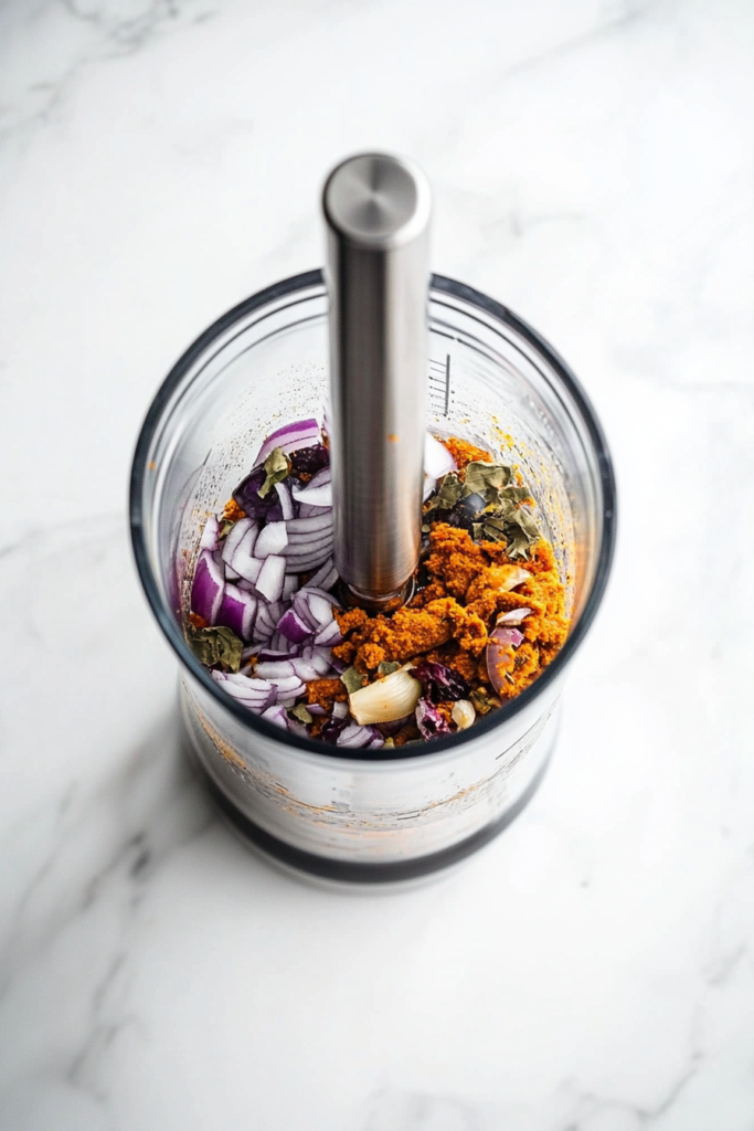 blending-fresh-spices-coconut-and-chilies-into-a-smooth-goan-curry-paste-2398562-683x1024