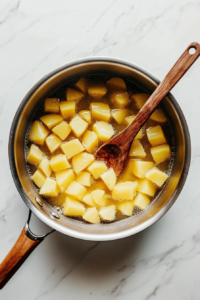 boiling-the-potatoes-until-tender-for-traditional-colcannon