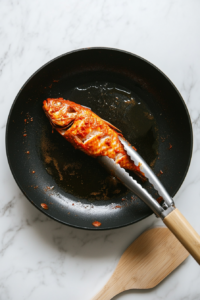 coating-the-whole-fish-with-spiced-marinade-for-deep-flavor-penetration