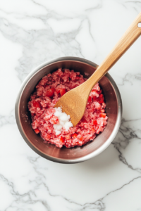 combining-strawberries-sugar-and-lemon-juice-in-a-saucepan