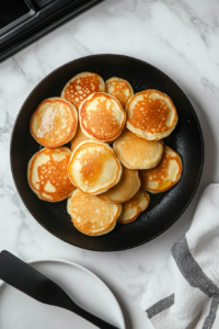 cooking-all-pancakes-on-a-skillet-before-assembly