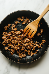 cooking-the-sausage-in-skillet-top-down-view