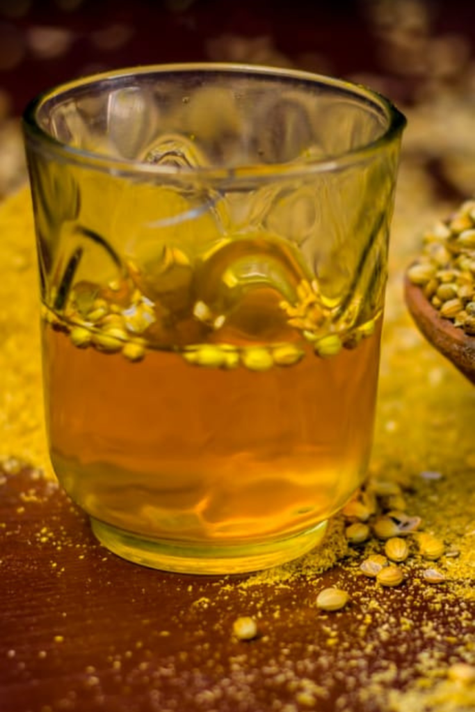 coriander-water-with-soaked-seeds-in-a-glass-on-a-wooden-tray